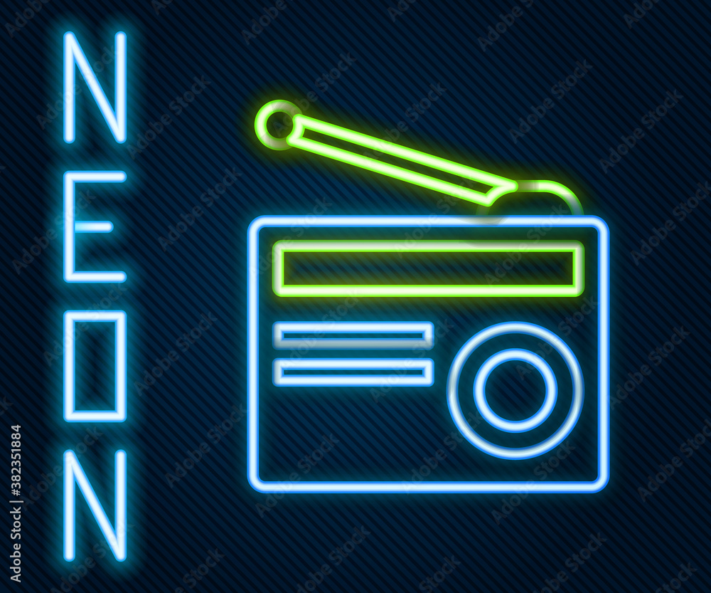 Glowing neon line Radio with antenna icon isolated on black background. Colorful outline concept. Ve