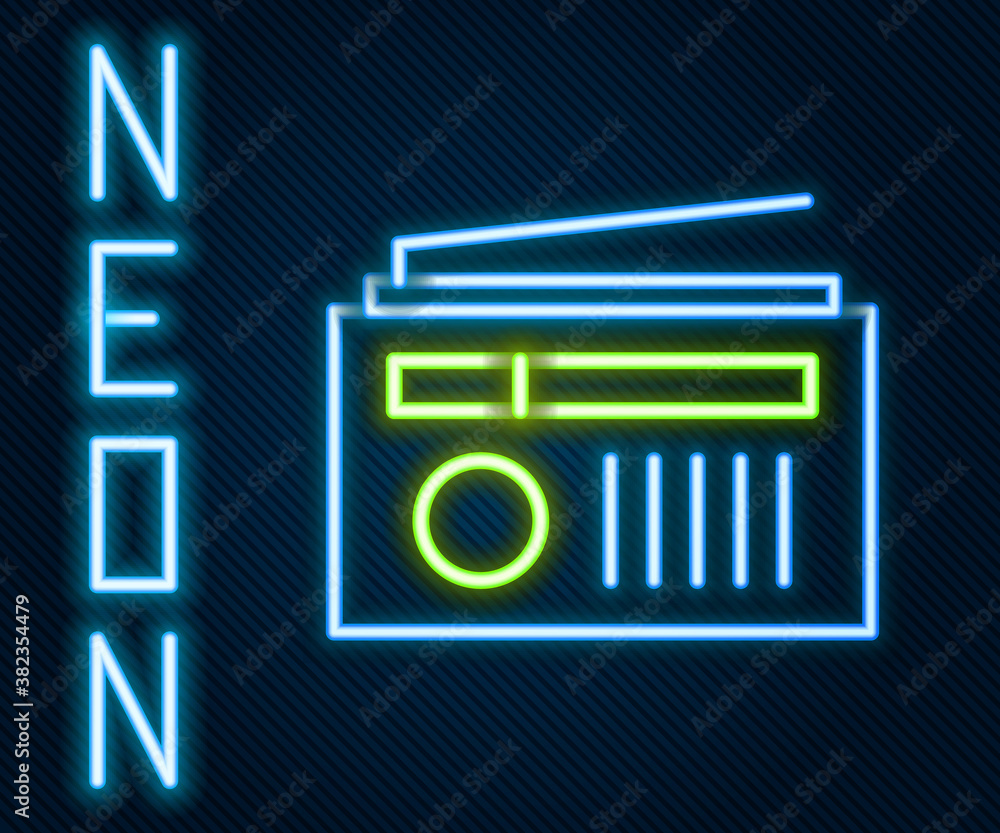 Glowing neon line Radio with antenna icon isolated on black background. Colorful outline concept. Ve