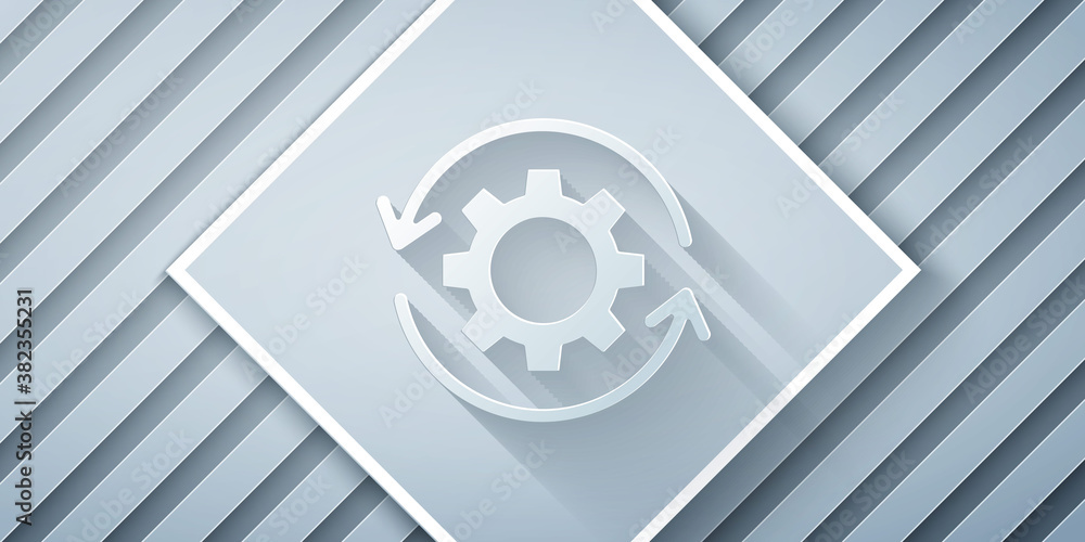 Paper cut Gear and arrows as workflow concept icon isolated on grey background. Gear reload sign. Pa