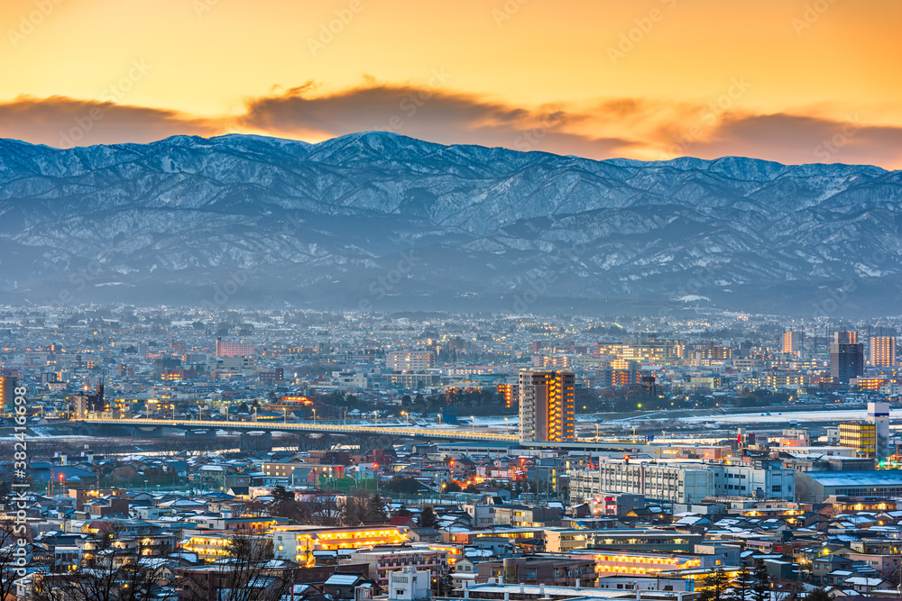 Toyama, Japan downtown city skyline with Tateyama Mountain