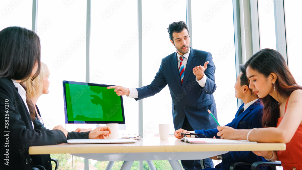 Business people in the conference room with green screen chroma key TV or computer on the office tab