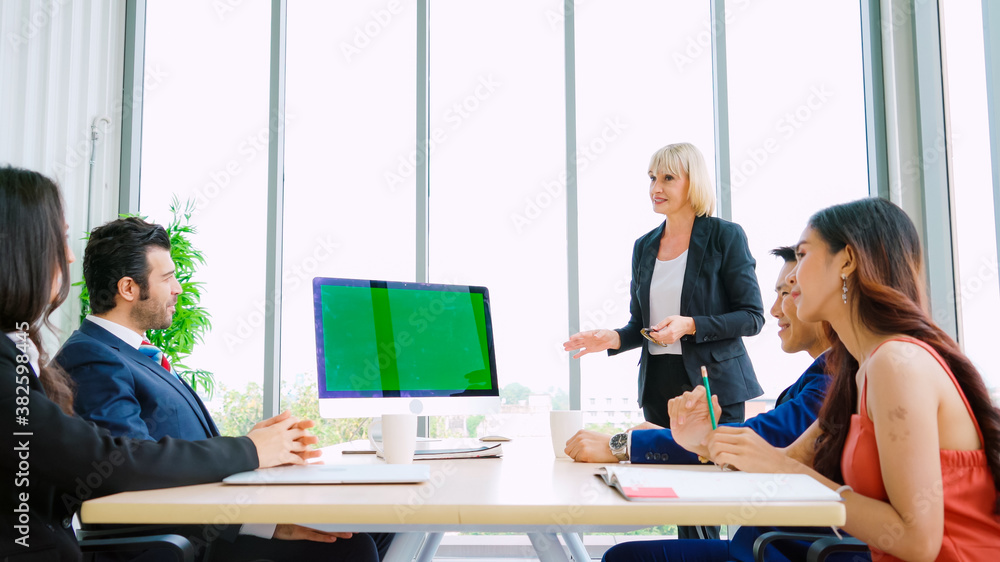 Business people in the conference room with green screen chroma key TV or computer on the office tab