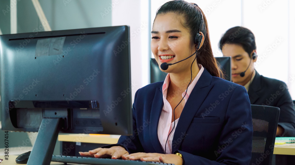 Business people wearing headset working in office to support remote customer or colleague. Call cent