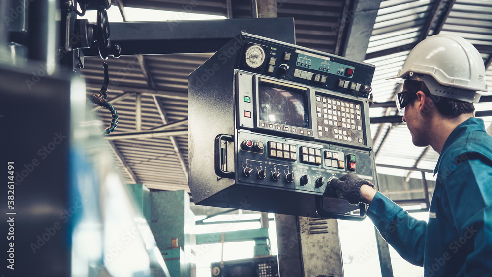 Smart factory worker using machine in factory workshop . Industry and engineering concept.