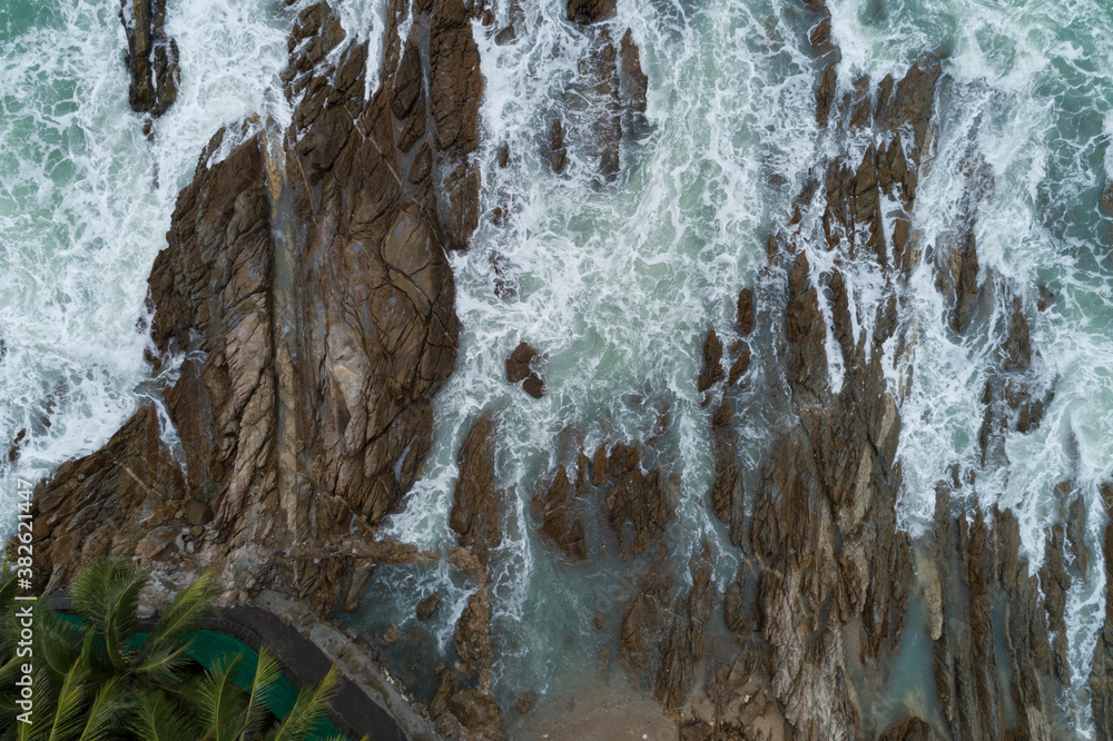 Aerial view of crashing waves on rocks landscape nature view and Beautiful tropical sea with Sea coa