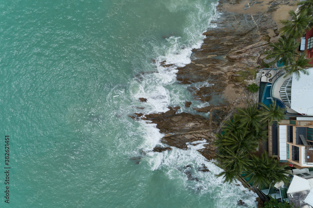 Aerial view of crashing waves on rocks landscape nature view and Beautiful tropical sea with Sea coa