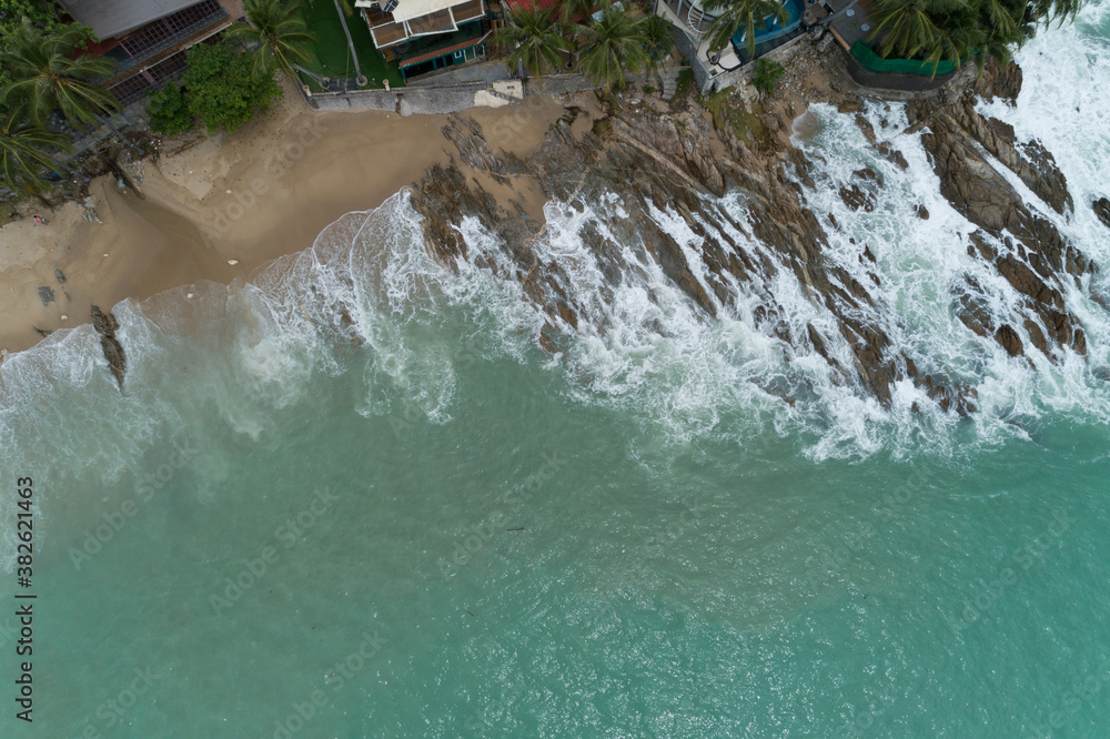 Aerial view of crashing waves on rocks landscape nature view and Beautiful tropical sea with Sea coa