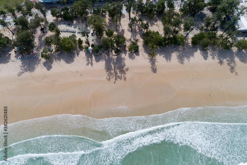 Aerial view sandy beach and crashing waves on sandy shore Beautiful tropical sea in the morning summ