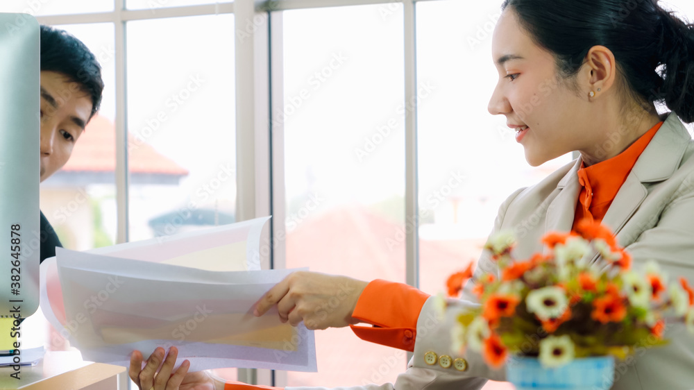 Two business people talk project strategy at office meeting room. Businessman discuss project planni