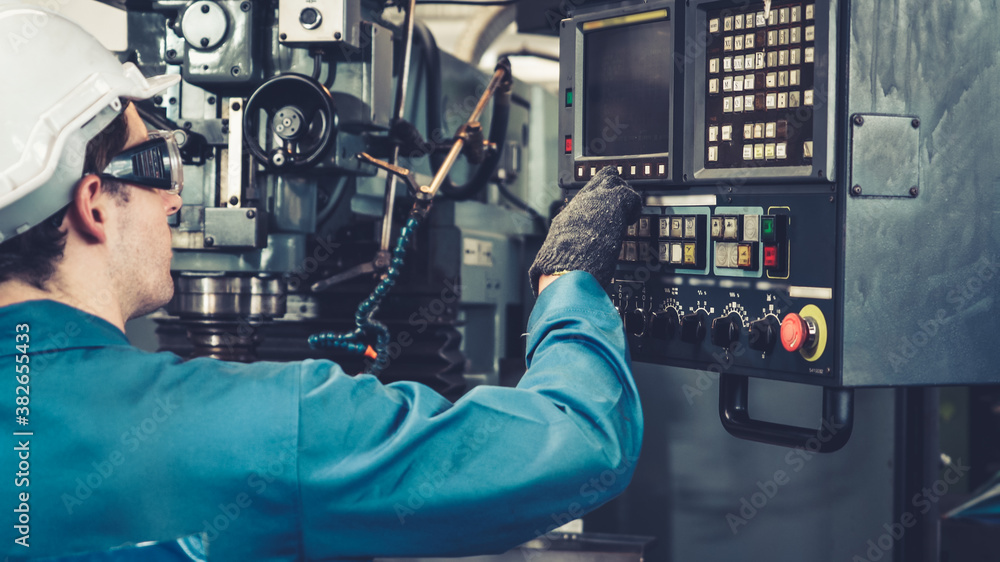 Smart factory worker using machine in factory workshop . Industry and engineering concept.