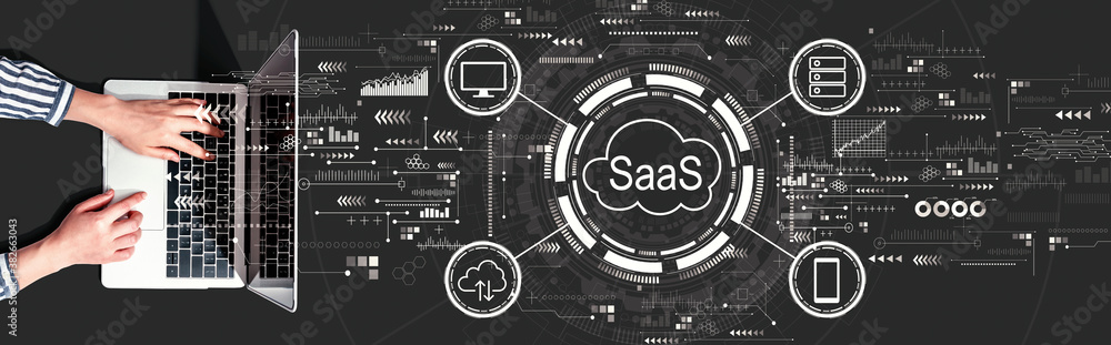 SaaS - software as a service concept with person using a laptop computer