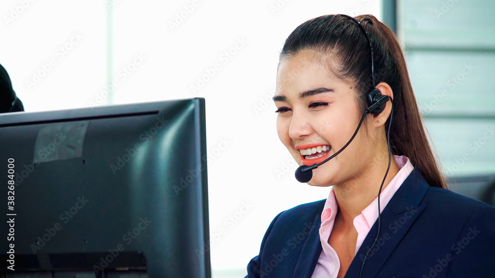 Business people wearing headset working in office to support remote customer or colleague. Call cent