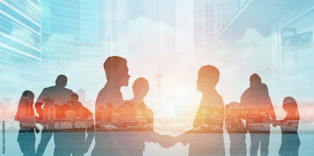 Silhouette view of business people team in group meeting on city office building background showing 