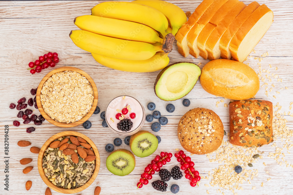 Group Fruits Breakfast with bread Whole grains and nuts, yogurt mix with Cherry , banana, avocado in