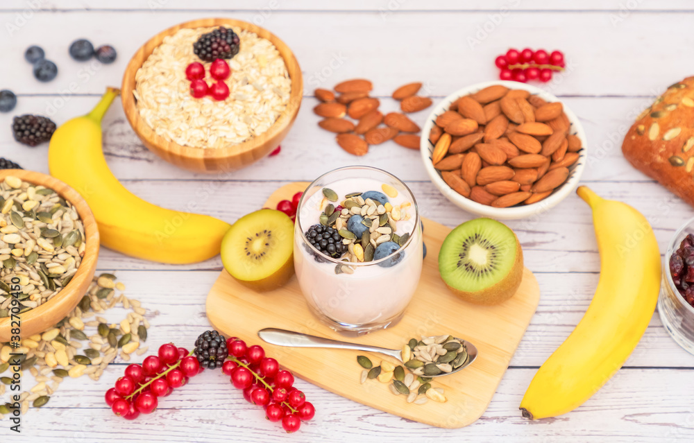 Group Fruits Breakfast with bread Whole grains and nuts, yogurt mix with Cherry , banana, avocado in