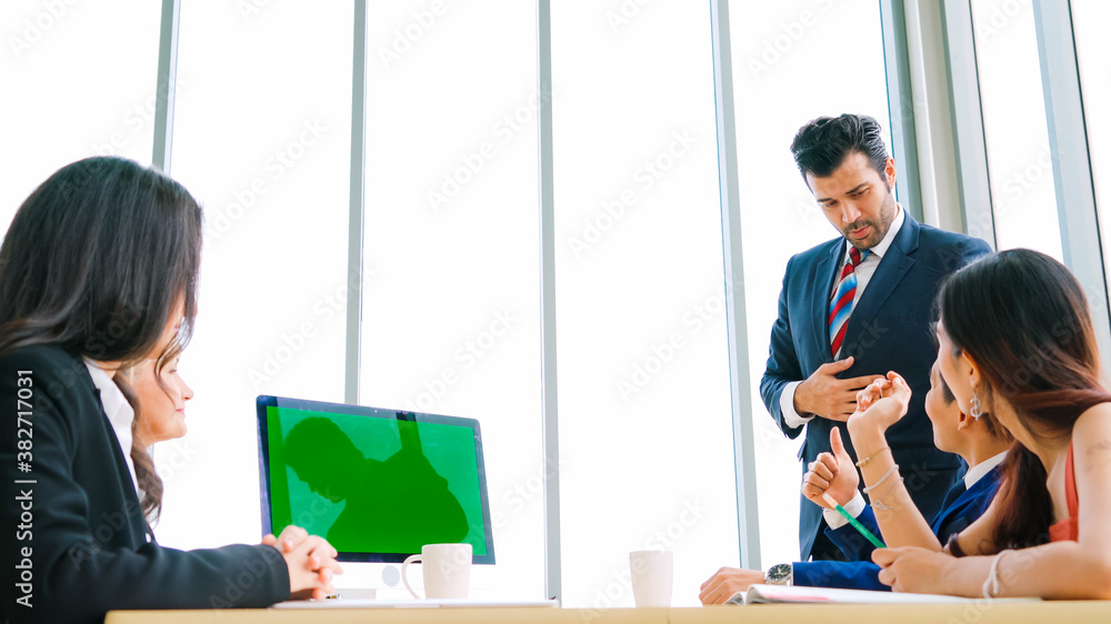 Business people in the conference room with green screen chroma key TV or computer on the office tab