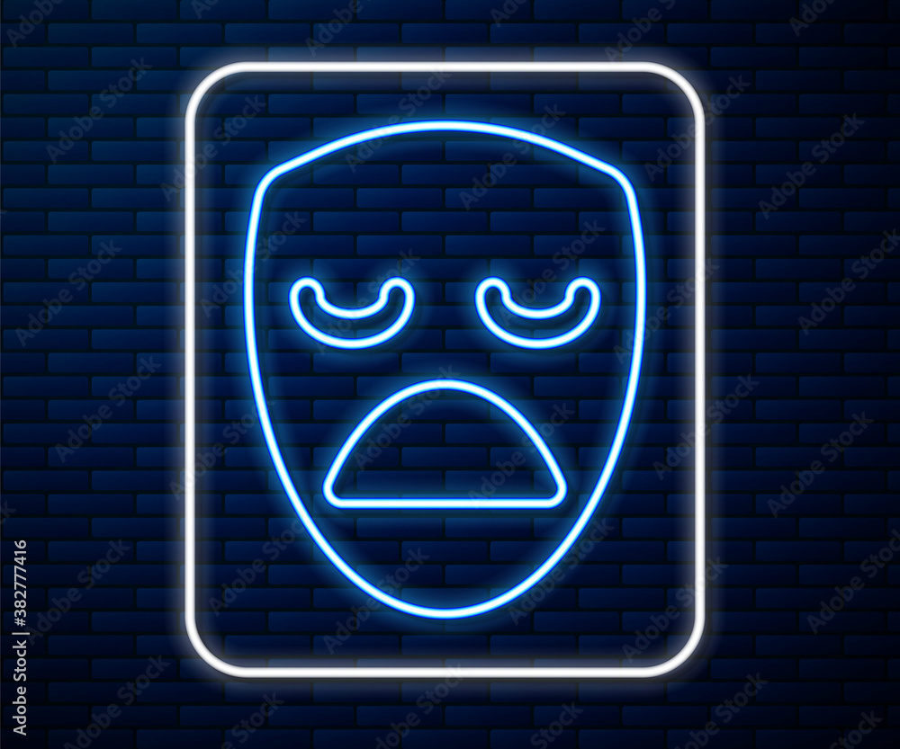 Glowing neon line Drama theatrical mask icon isolated on brick wall background. Vector.