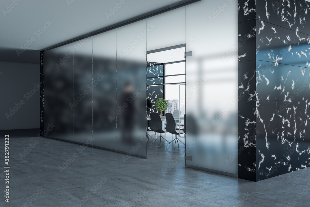 Businessman standing interior with blurred glass wall.