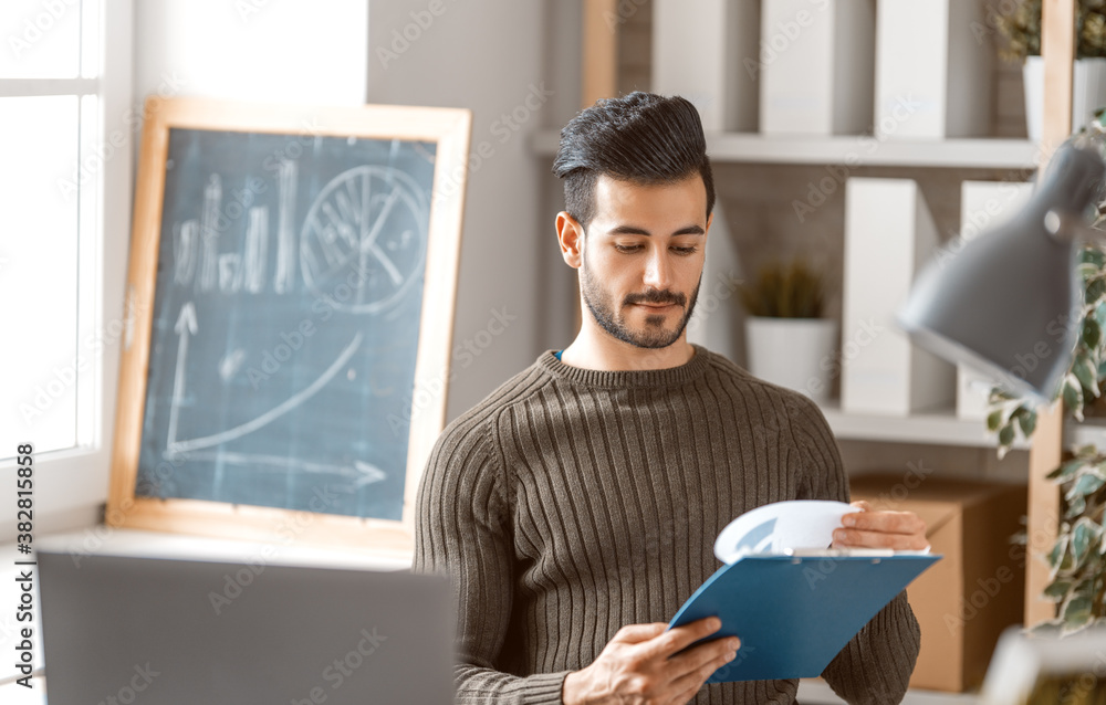 man working on a laptop at home.