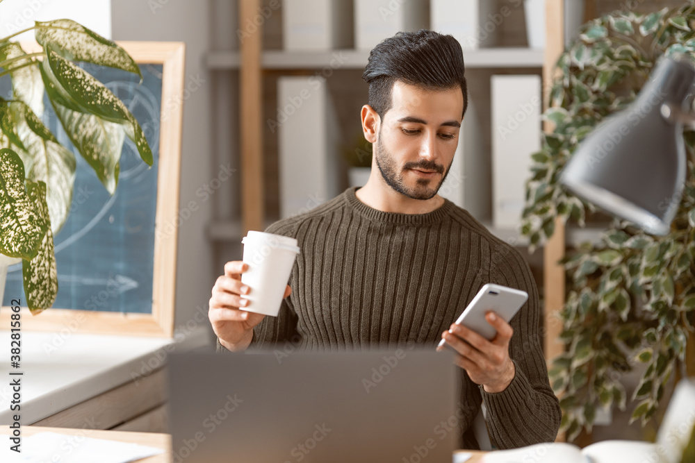 man working on a laptop at home.