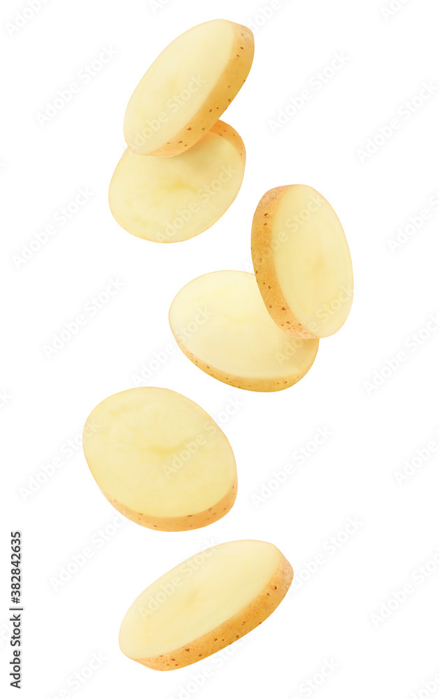 Isolated potato pieces in the air. Unpeeled slices of raw washed potato falling down over white back