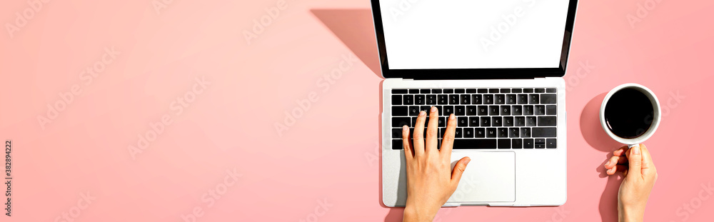 Person using a laptop computer from above