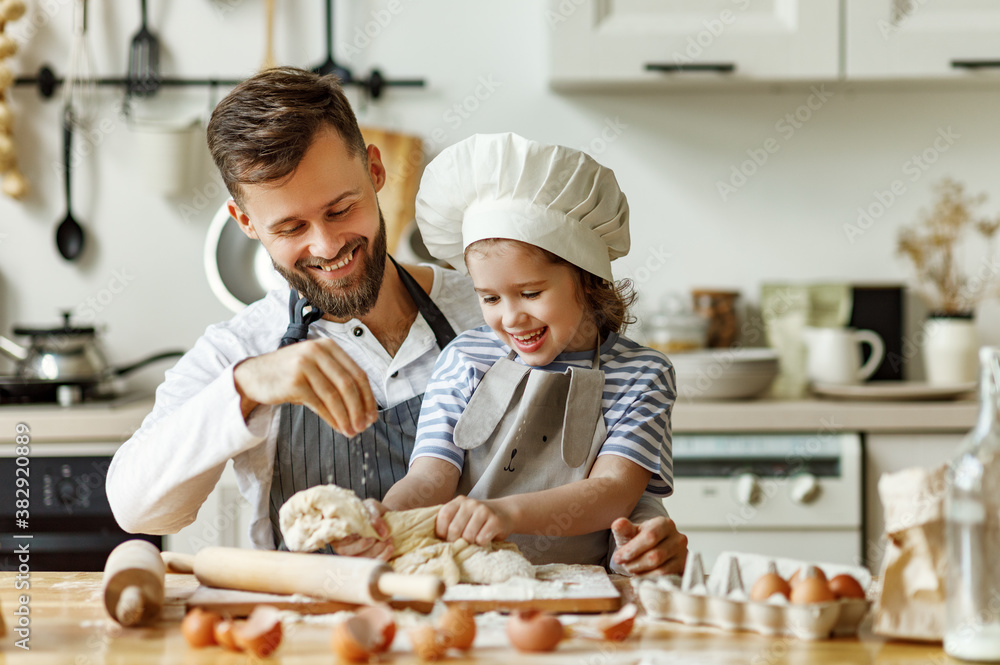 Father and daughter making pastry together.