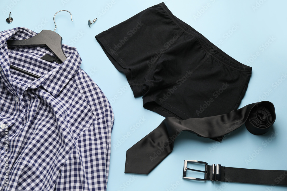 Stylish male clothes and accessories on color background