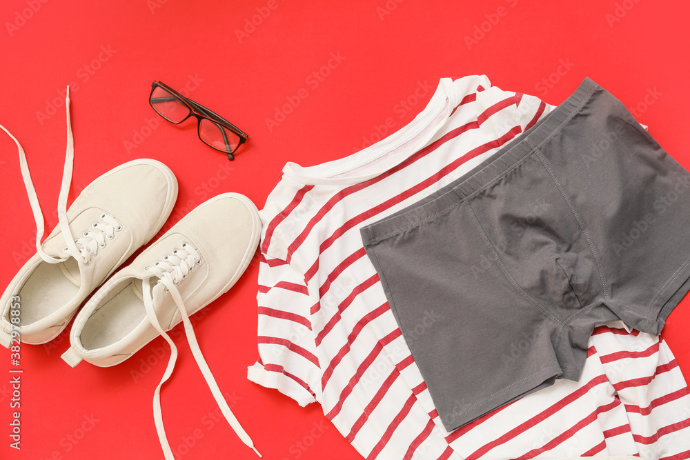 Stylish male clothes and accessories on color background