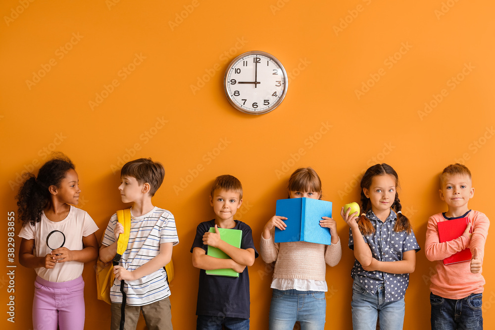 Cute pupils on color background