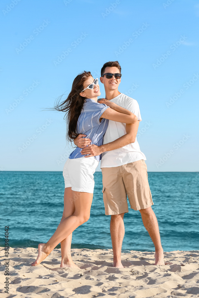 Happy young couple on sea beach