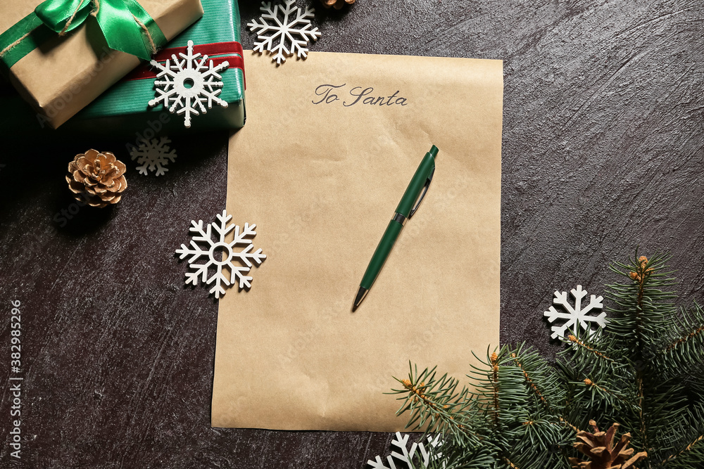 Letter to Santa and Christmas decor on dark background