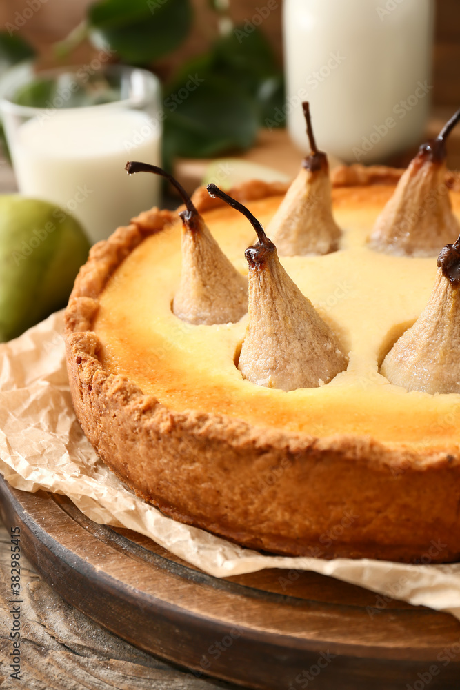 Board with tasty pear cake, closeup