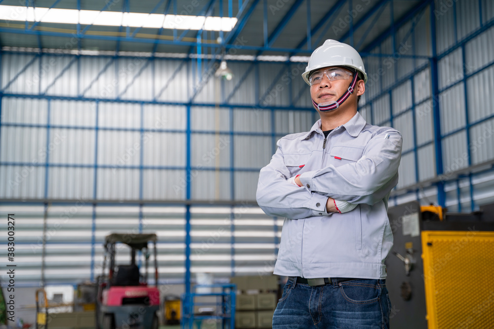 Portrait of manual asian man worker is standing confident with confident with working suite dress an