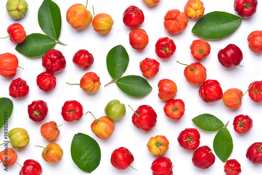 Flat lay pattern of fresh Acerola cherry with green leaves on white background, Top view