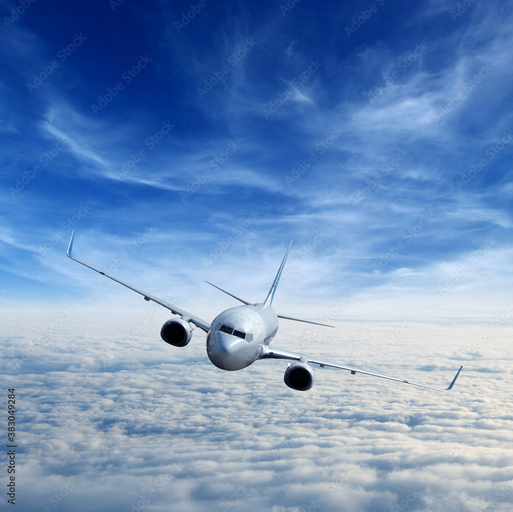 Landscape with airplane is flying in the blue sky and white clouds.