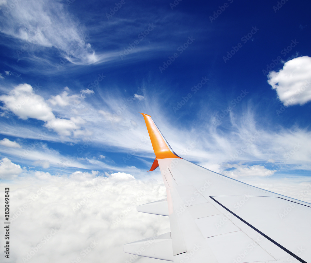 Wing of the plane on sky