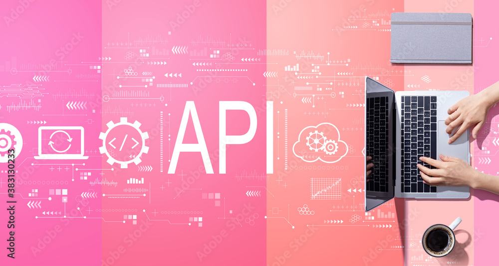 API - application programming interface concept with person working with a laptop