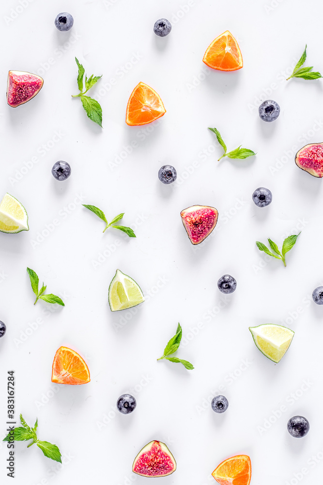 cut fruit pattern with mint on white desk background top view