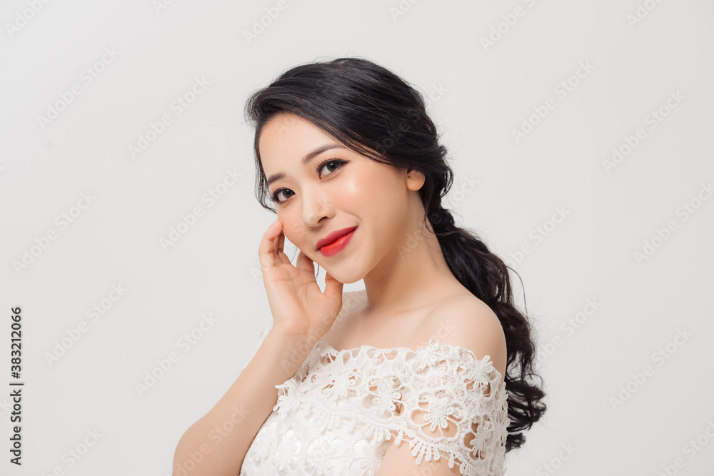 Portrait of beautiful elegant young Asian woman on white background.