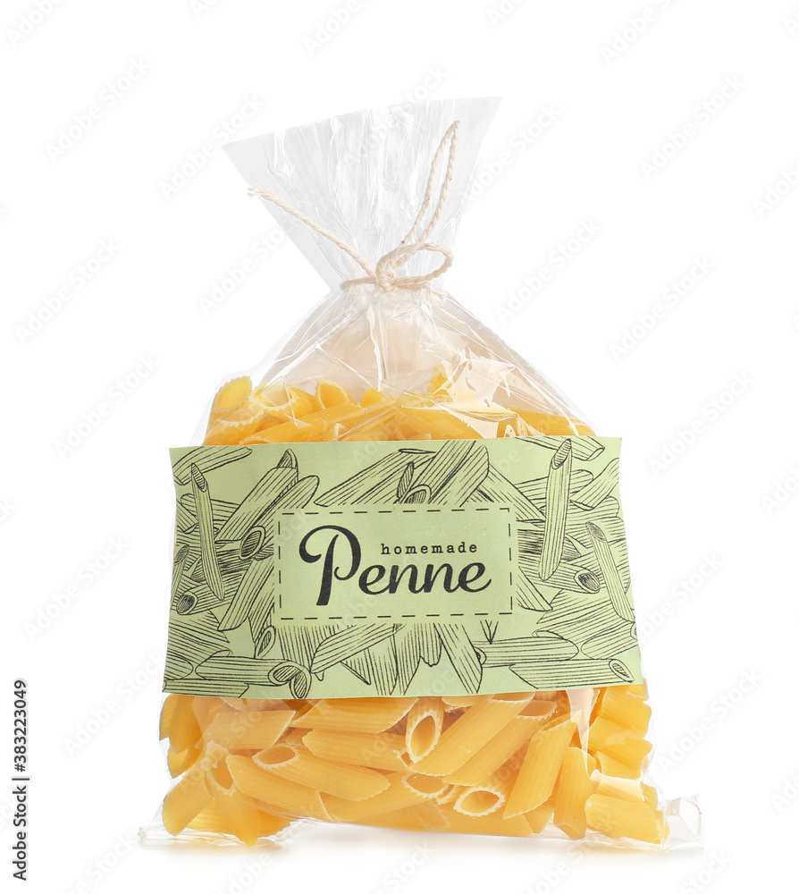 Bag with uncooked Italian pasta on white background