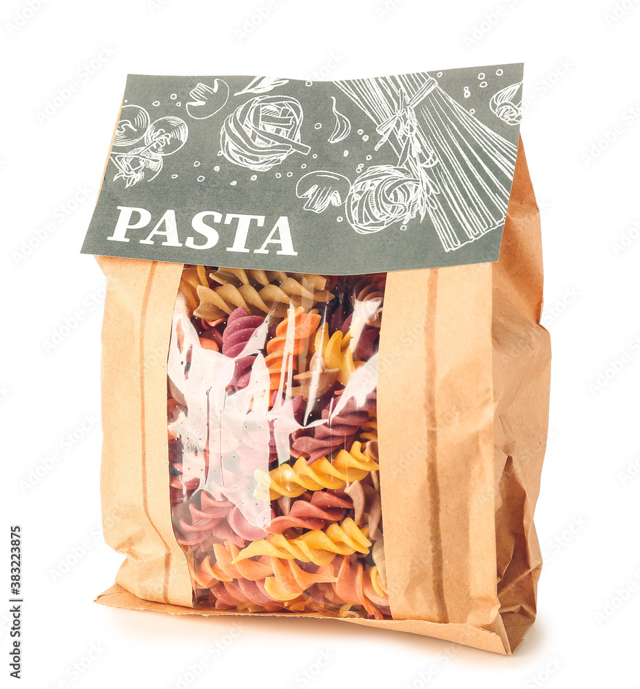 Bag with uncooked Italian pasta on white background