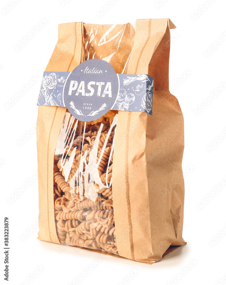 Bag with uncooked Italian pasta on white background