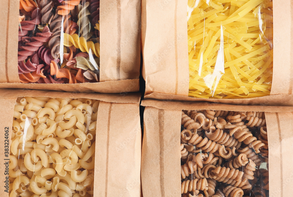 Bags with uncooked Italian pasta, closeup