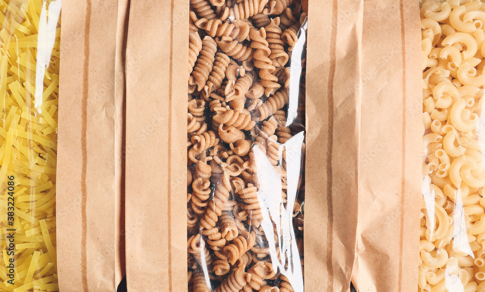 Bags with uncooked Italian pasta, closeup