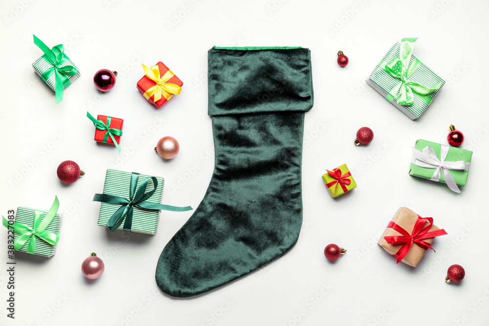 Composition with Christmas sock on white background