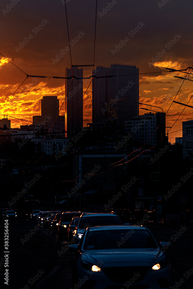 Evening traffic in the city at sunset