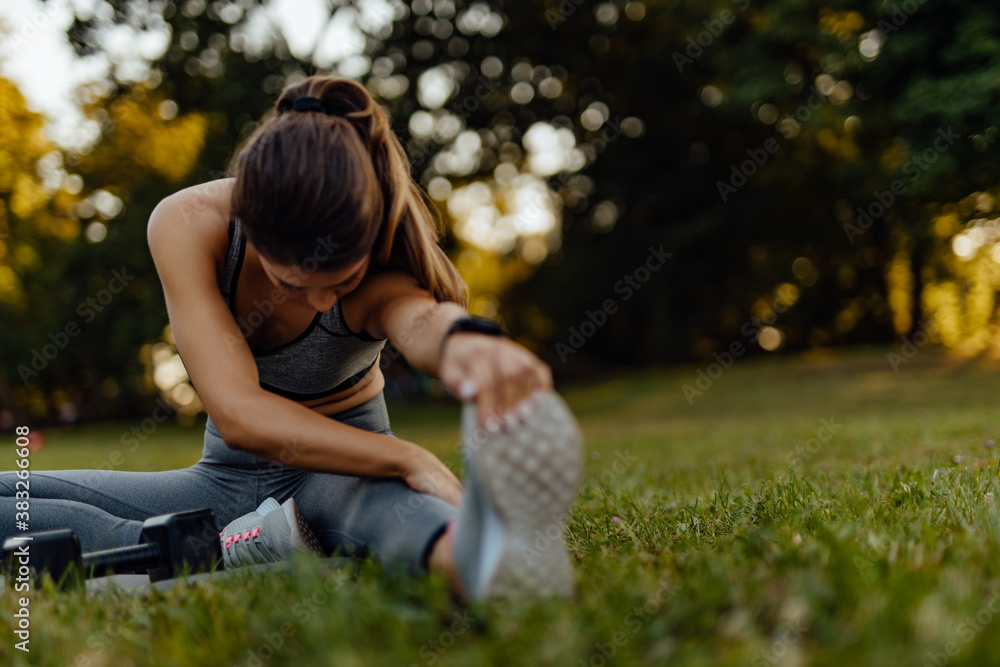 Stretching her leg.