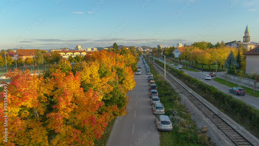 DRONE: Flying along an empty railway running across the suburbs of Ljubljana.