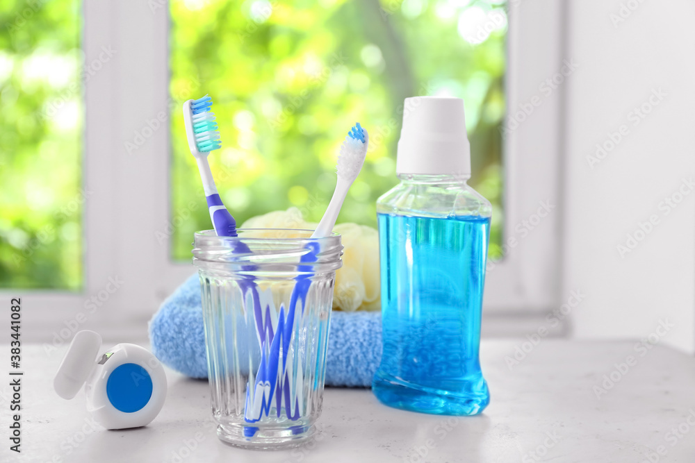 Set for oral hygiene on table in bathroom